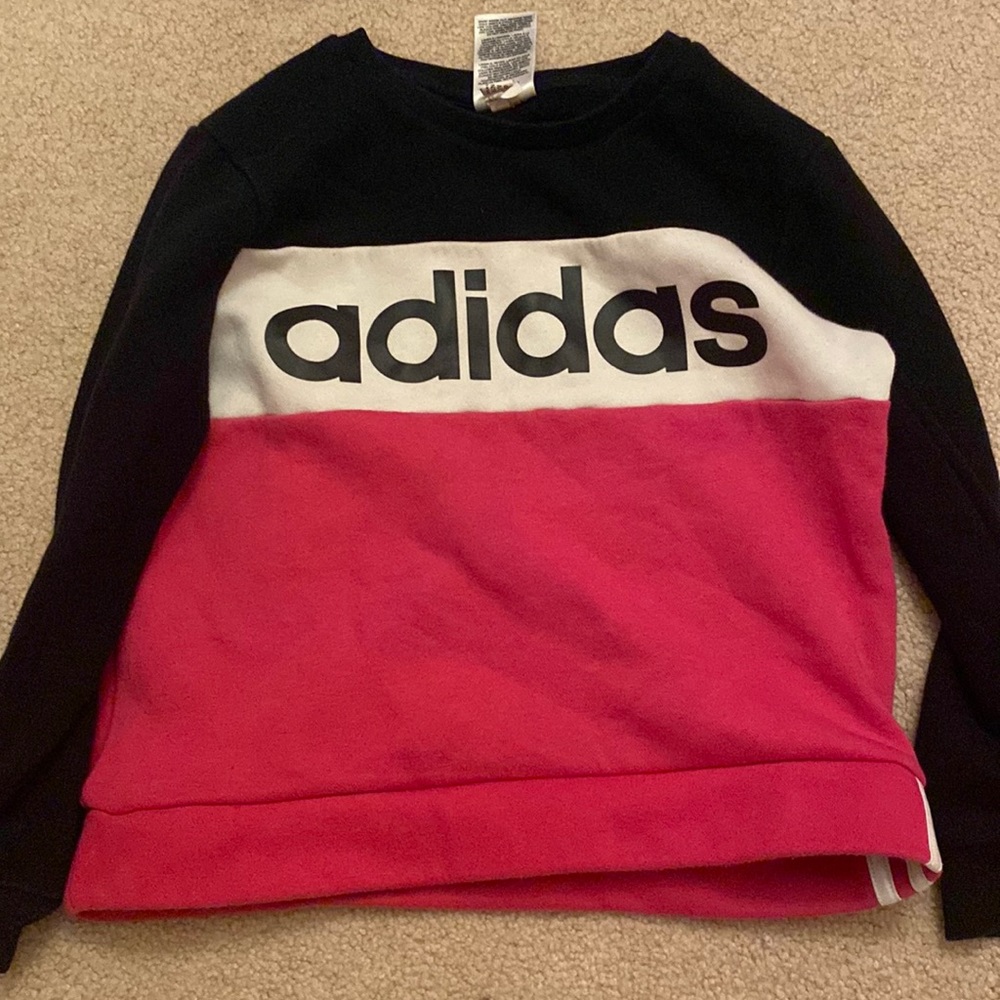 Adidas’s black white and pink sweater